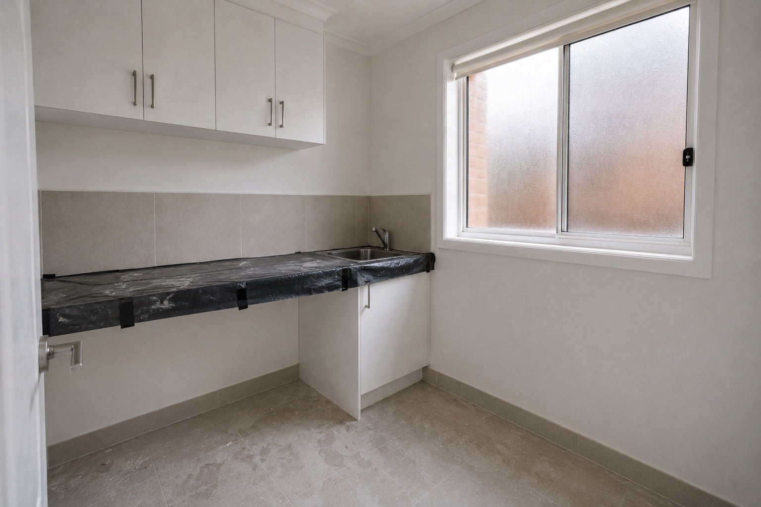 Laundry before the Burwood home handover clean