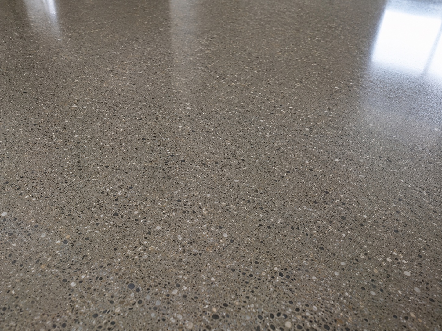 Polished concrete floor clean and free of construction film after handover cleaning