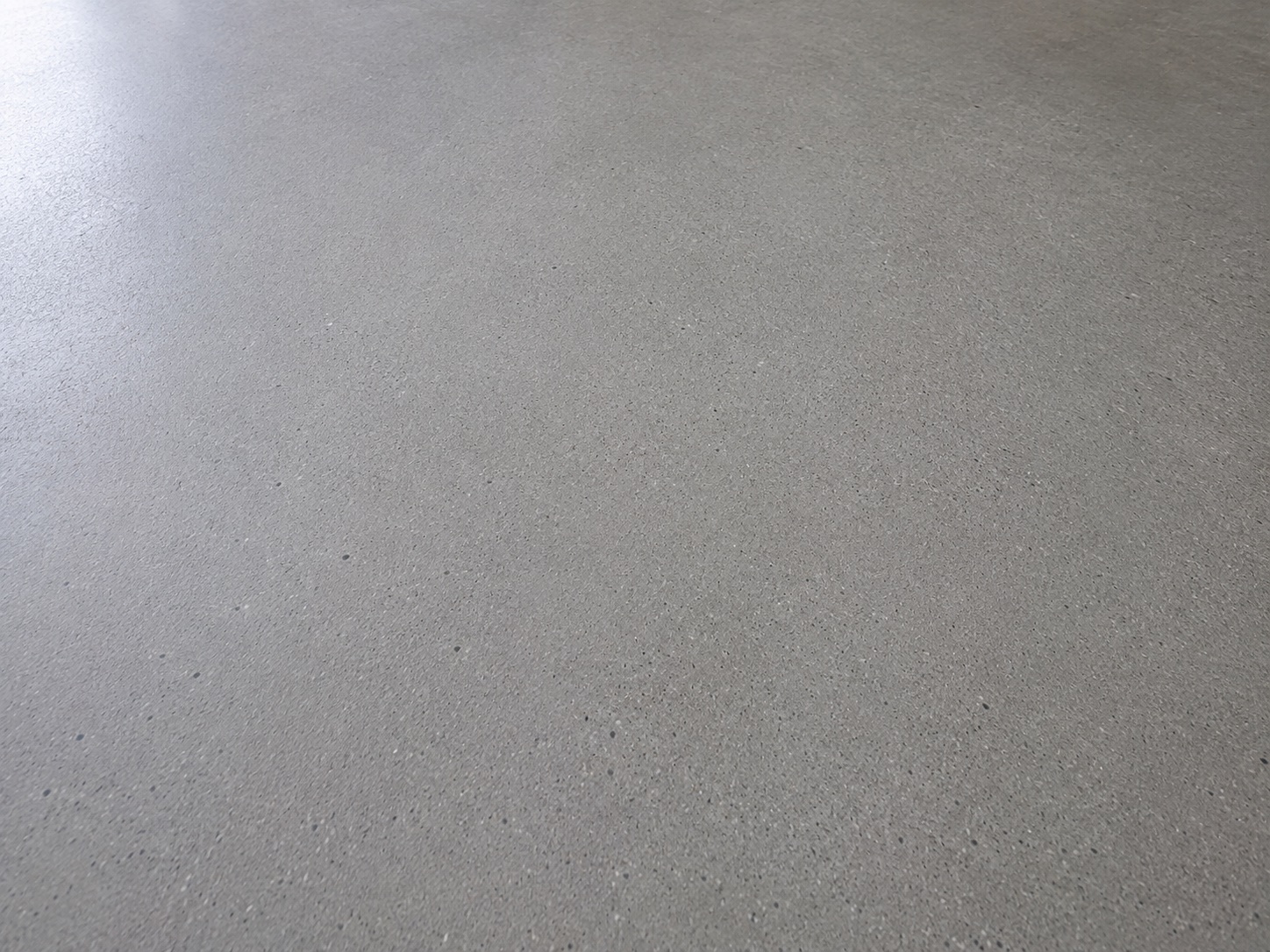 Raw concrete floor after construction dust and loose debris cleaning in a Sydney new build